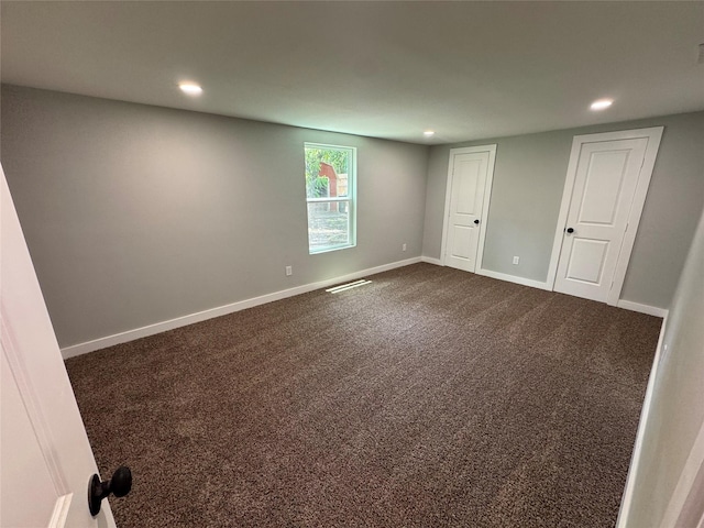 1220 Brittany Ln, Arlington, TX 76013 - empty room with recessed lighting, dark colored carpet, and baseboards