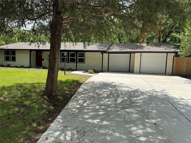 1220 Brittany Ln, Arlington, TX 76013 - view of front facade with driveway, a garage, brick siding, and a shingled roof