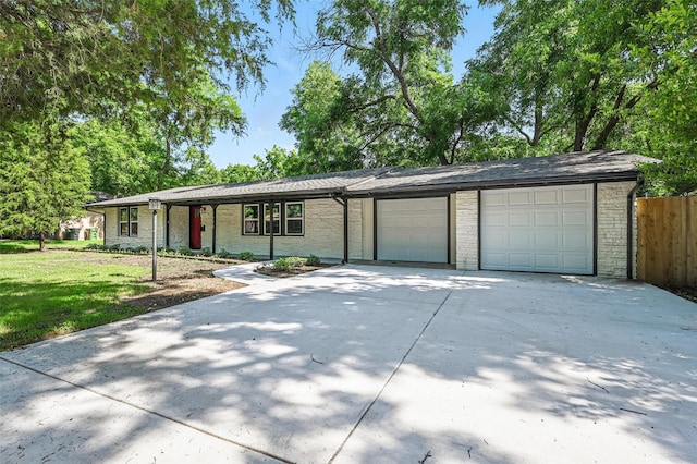 1220 Brittany Ln, Arlington, TX 76013 - view of front of property with concrete driveway, a garage, and brick siding