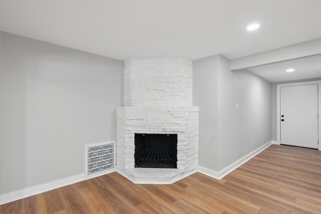 1220 Brittany Ln, Arlington, TX 76013 - unfurnished living room featuring a fireplace, wood finished floors, baseboards, and recessed lighting
