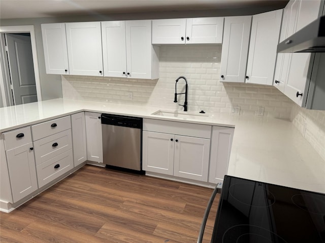 1220 Brittany Ln, Arlington, TX 76013 - kitchen with dishwasher, a sink, under cabinet range hood, light countertops, and white cabinets