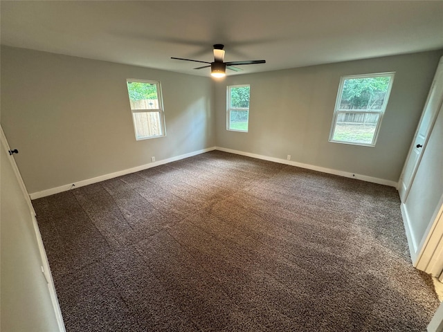 1220 Brittany Ln, Arlington, TX 76013 - unfurnished room featuring ceiling fan, dark carpet, and baseboards