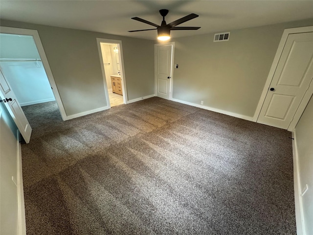 1220 Brittany Ln, Arlington, TX 76013 - unfurnished bedroom with baseboards, dark colored carpet, ensuite bathroom, and ceiling fan