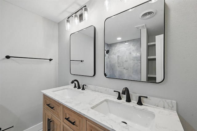 1220 Brittany Ln, Arlington, TX 76013 - bathroom featuring double vanity and a shower