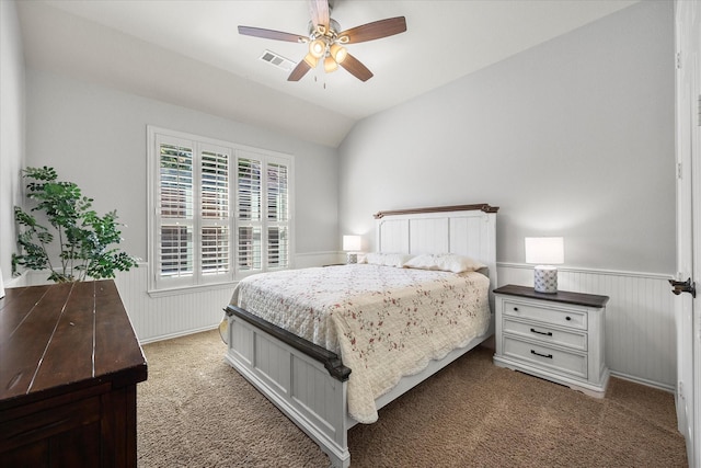 227 Justin Rd, Murphy, TX 75094 - carpeted bedroom featuring a wainscoted wall, vaulted ceiling, and ceiling fan