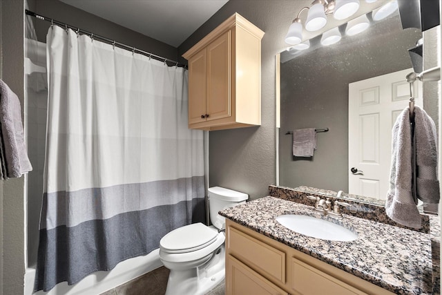 227 Justin Rd, Murphy, TX 75094 - full bathroom featuring toilet, vanity, tile patterned floors, a textured wall, and shower / tub combo with curtain