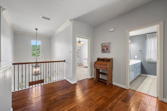 227 Justin Rd, Murphy, TX 75094 - hall with hardwood / wood-style floors, crown molding, and a chandelier