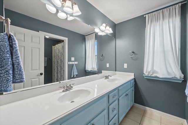 227 Justin Rd, Murphy, TX 75094 - bathroom featuring tile patterned flooring, baseboards, and double vanity