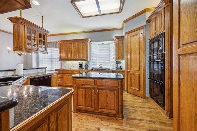 4024 Oakmeadow Dr, Plano, TX 75093 - kitchen featuring crown molding, black appliances, light wood-type flooring, brown cabinets, and glass insert cabinets