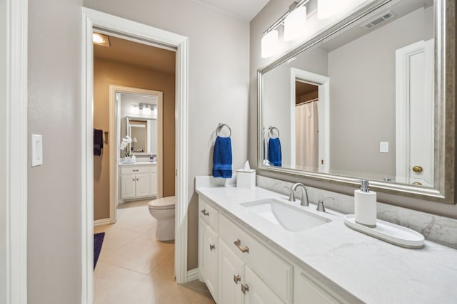 4024 Oakmeadow Dr, Plano, TX 75093 - bathroom with tile patterned floors, vanity, toilet, and baseboards