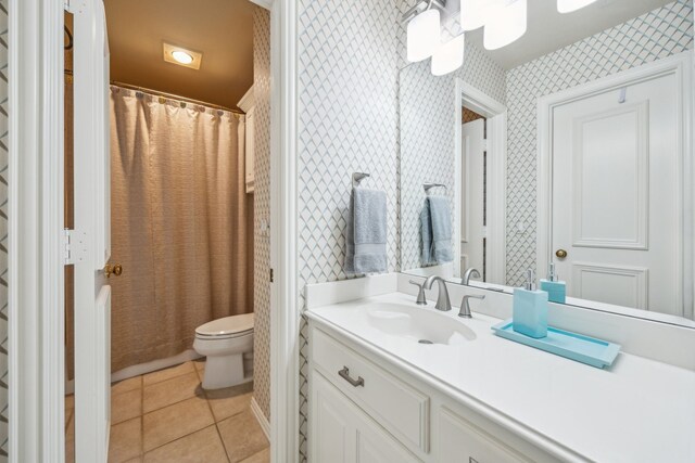 4024 Oakmeadow Dr, Plano, TX 75093 - bathroom featuring wallpapered walls, toilet, vanity, and tile patterned flooring