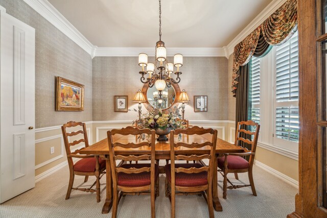 4024 Oakmeadow Dr, Plano, TX 75093 - carpeted dining space featuring a chandelier, wainscoting, wallpapered walls, and crown molding
