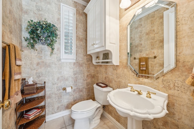 4024 Oakmeadow Dr, Plano, TX 75093 - half bathroom featuring toilet, a sink, tile patterned flooring, and baseboards