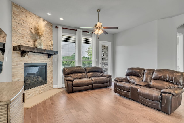 14937 Belclaire Ave, Aledo, TX 76008 - living area featuring a ceiling fan, a fireplace, wood finished floors, recessed lighting, and arched walkways