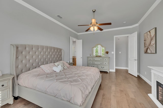14937 Belclaire Ave, Aledo, TX 76008 - bedroom featuring wood finished floors, ornamental molding, a fireplace, baseboards, and ceiling fan