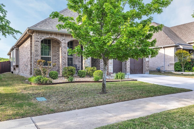 14937 Belclaire Ave, Aledo, TX 76008 - french country inspired facade with concrete driveway, a front yard, and brick siding