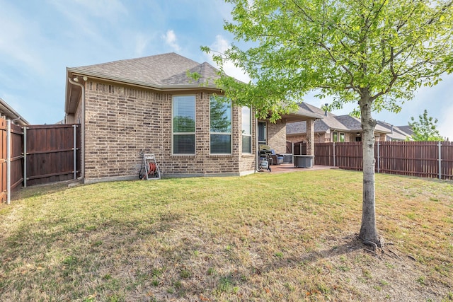 14937 Belclaire Ave, Aledo, TX 76008 - rear view of property featuring brick siding, roof with shingles, and a patio area