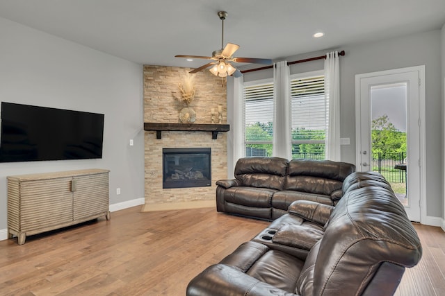 14937 Belclaire Ave, Aledo, TX 76008 - living area featuring ceiling fan, a stone fireplace, wood finished floors, recessed lighting, and baseboards