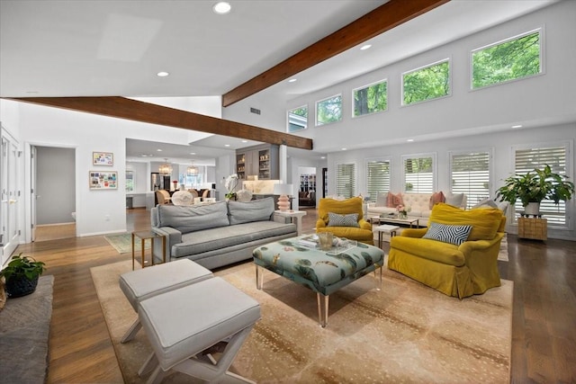 living area with recessed lighting, a chandelier, beam ceiling, wood finished floors, and high vaulted ceiling