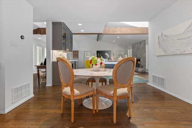 dining area featuring baseboards, a premium fireplace, recessed lighting, and dark wood finished floors
