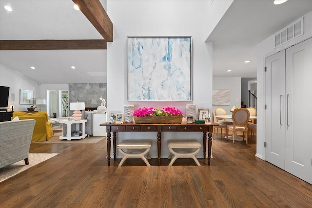 dining room featuring wood finished floors, stairs, beamed ceiling, and recessed lighting