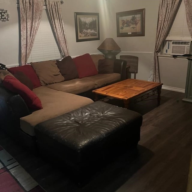 904 Church St, Winnsboro, TX 75494 - living area with cooling unit, wood finished floors, and baseboards