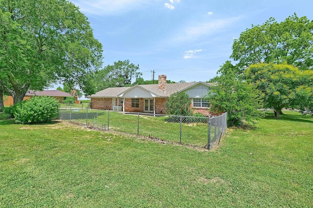 view of front of house with a chimney and brick siding