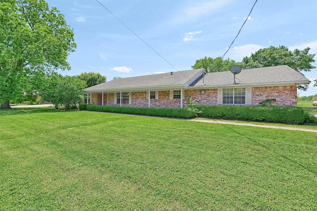 ranch-style home featuring a front yard