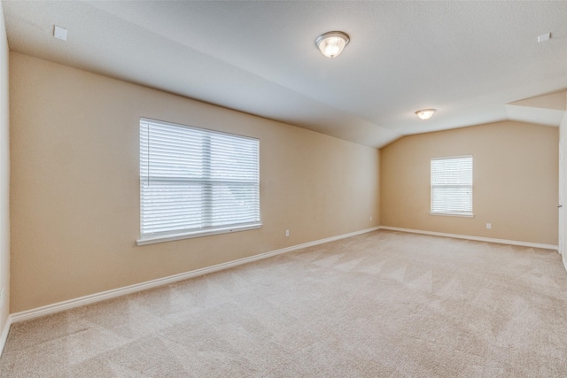 5844 Sunny Meadow Ln, Grand Prairie, TX 75052 - empty room with carpet, lofted ceiling, and baseboards