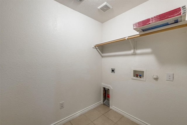 5844 Sunny Meadow Ln, Grand Prairie, TX 75052 - laundry room featuring baseboards, hookup for an electric dryer, hookup for a washing machine, light tile patterned floors, and gas dryer hookup