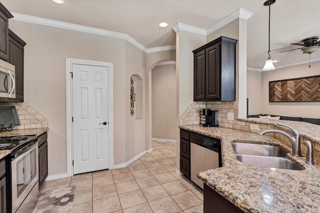 1823 Woodland Park Dr, Denison, TX 75021 - kitchen with appliances with stainless steel finishes, a sink, ceiling fan, tasteful backsplash, and light stone counters