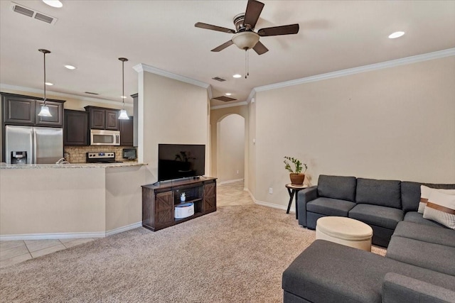 1823 Woodland Park Dr, Denison, TX 75021 - living area featuring arched walkways, a ceiling fan, ornamental molding, recessed lighting, and light carpet