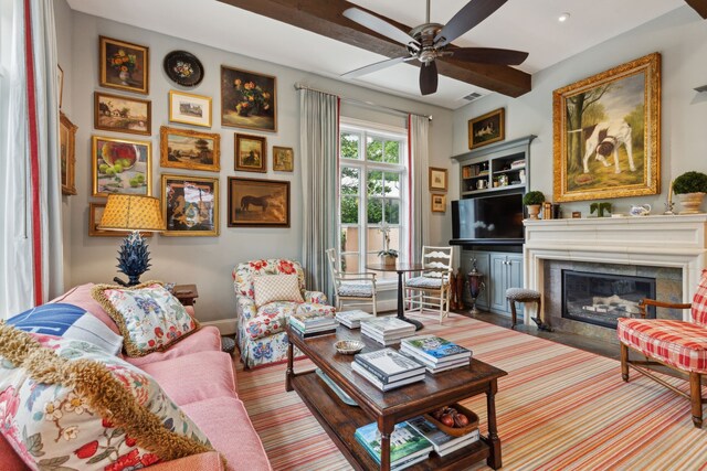 3725 Turtle Creek Blvd Unit A, Dallas, TX 75219 - living room with ceiling fan, a glass covered fireplace, and baseboards