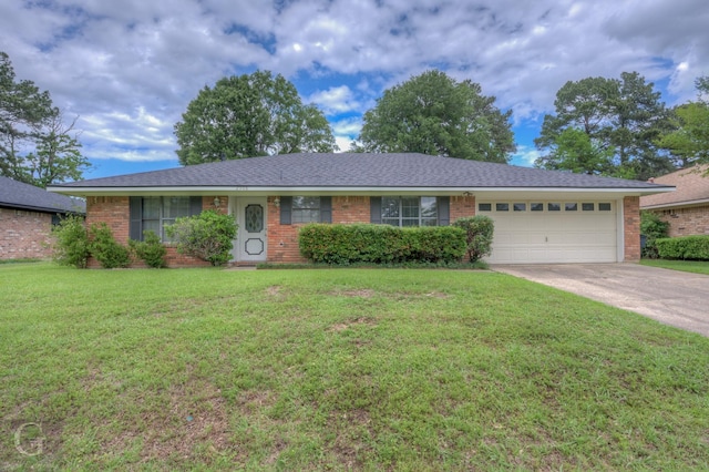 single story home with brick siding, an attached garage, concrete driveway, and a front lawn