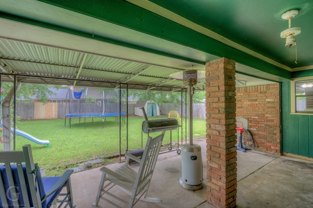 view of patio featuring a storage shed, a trampoline, a playground, and an outbuilding