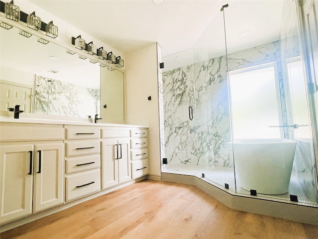 113 County Road 3198, Decatur, TX 76234 - bathroom with wood finished floors, a marble finish shower, and double vanity