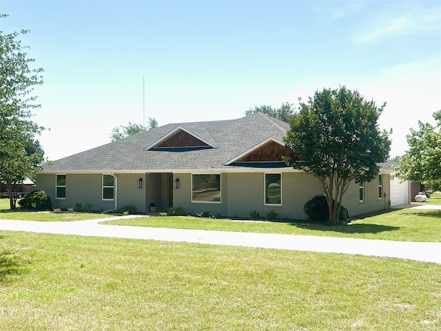 113 County Road 3198, Decatur, TX 76234 - view of front of property with a front yard, roof with shingles, and a garage