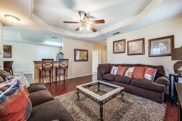 3406 Nomas St, Dallas, TX 75212 - living room with a tray ceiling, crown molding, wood finished floors, and ceiling fan