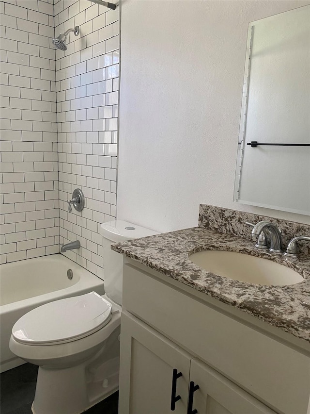 907 W 8th St, Bonham, TX 75418 - full bath with toilet, vanity, and bathing tub / shower combination