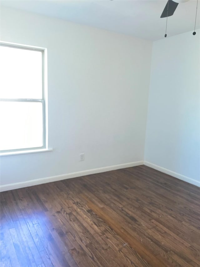 907 W 8th St, Bonham, TX 75418 - empty room with dark wood finished floors and baseboards