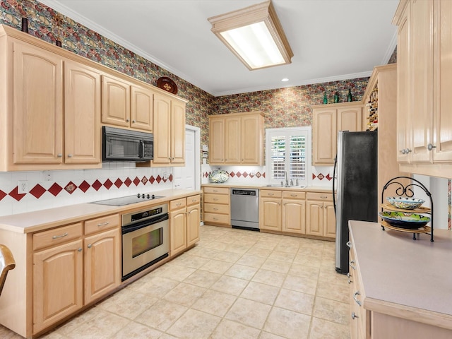 1457 Susan Ln, Carrollton, TX 75007 - kitchen with black appliances, light brown cabinetry, light countertops, backsplash, and wallpapered walls