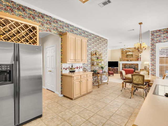 1457 Susan Ln, Carrollton, TX 75007 - kitchen with stainless steel fridge with ice dispenser, wallpapered walls, light countertops, light brown cabinets, and light tile patterned floors