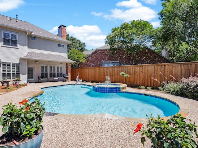 1457 Susan Ln, Carrollton, TX 75007 - view of pool with a fenced backyard, a pool with connected hot tub, and a patio