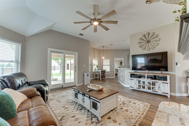 6367 Bridle Trl, Caddo Mills, TX 75135 - living room featuring ceiling fan, plenty of natural light, wood finished floors, vaulted ceiling, and baseboards