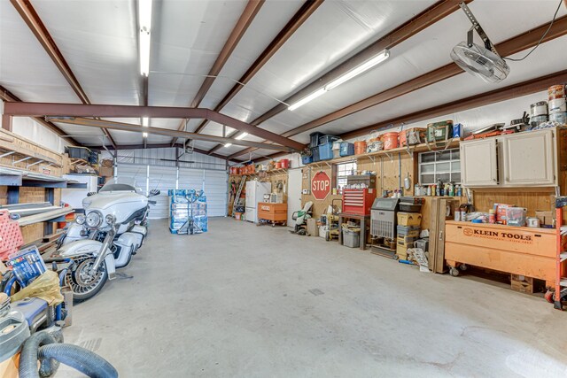 6367 Bridle Trl, Caddo Mills, TX 75135 - garage featuring a workshop area