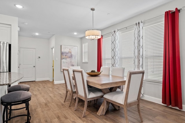 2606 High Cotton Ln, Garland, TX 75042 - dining space featuring baseboards, light wood-style floors, and recessed lighting