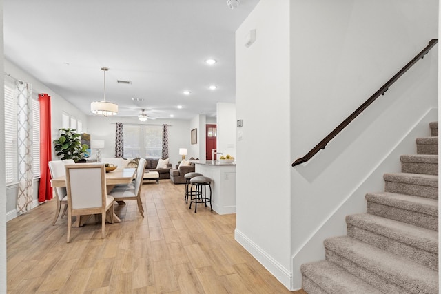 2606 High Cotton Ln, Garland, TX 75042 - dining area with a ceiling fan, light wood-type flooring, stairs, recessed lighting, and baseboards