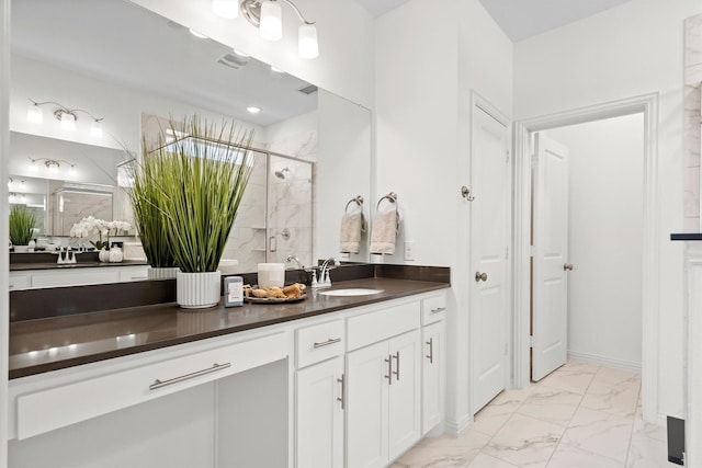 2606 High Cotton Ln, Garland, TX 75042 - full bath featuring a stall shower, marble look tiles, and vanity