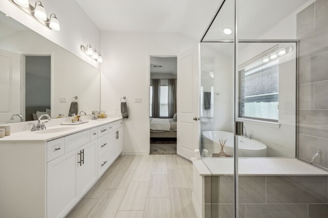 2812 Quill Ln, Northlake, TX 76247 - ensuite bathroom with plenty of natural light, double vanity, and a freestanding bath