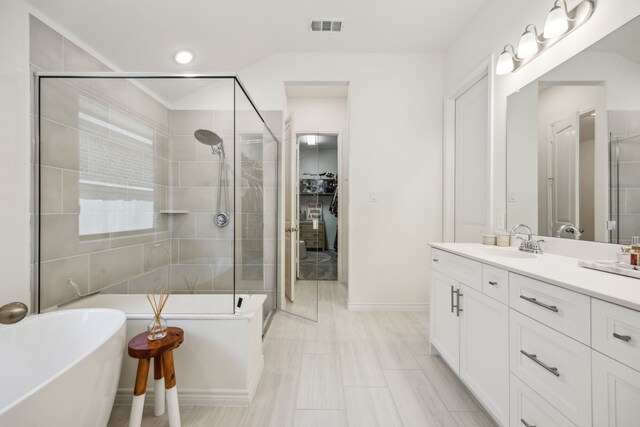 2812 Quill Ln, Northlake, TX 76247 - bathroom with a shower stall, a freestanding bath, vanity, and baseboards